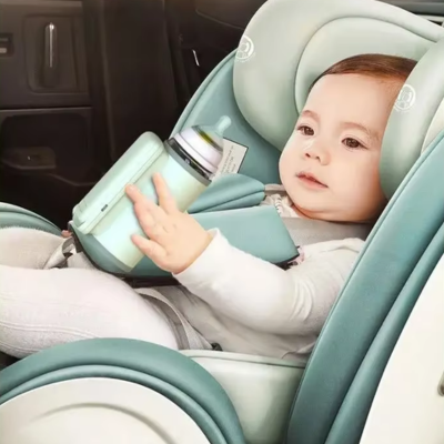 Chauffe biberon nomade steppe bébé assis dans son cosy