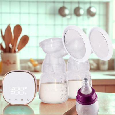 Tire lait main libre rose dans cuisine