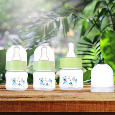 Biberon chouchou sous verdure