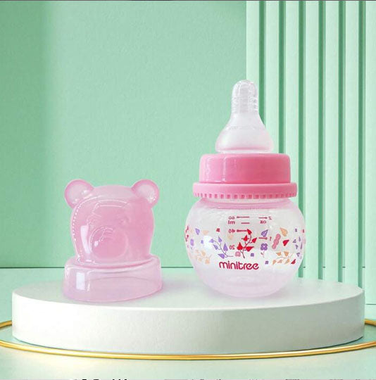 Biberon mimi presente sur un socle