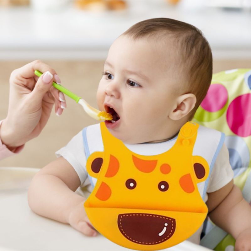 Bavoir Bebe Bebe Rigolo mange avec cuillère