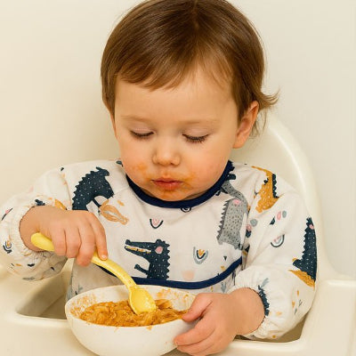 Bavoir bebe Elegance pratique enfant qui mange dans bol