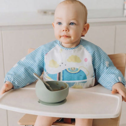 Bavoir Bebe Petit Ange assis devant son bol vert