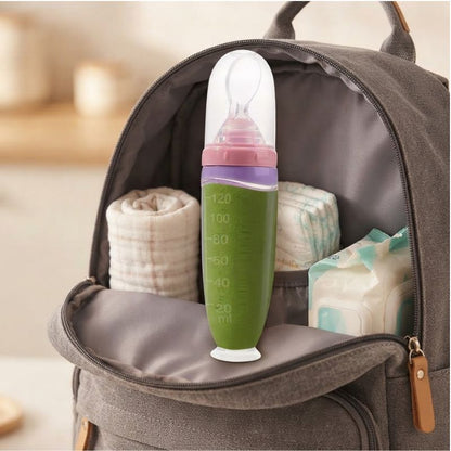 Biberon cuillère 2 en 1 Nomade poser sur sac a langer