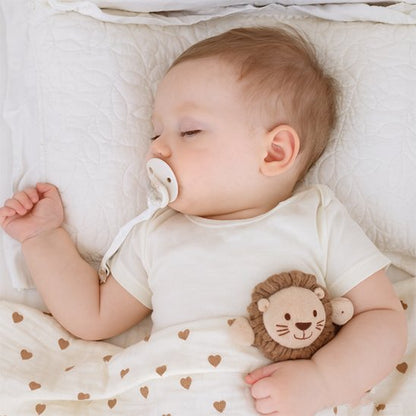 Attache tetine bebe dort calmement dans son berceau