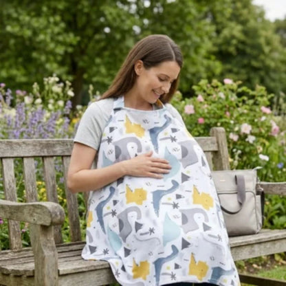 maman assise sur un banc son bebe couvert avec la cape d'allaitemen