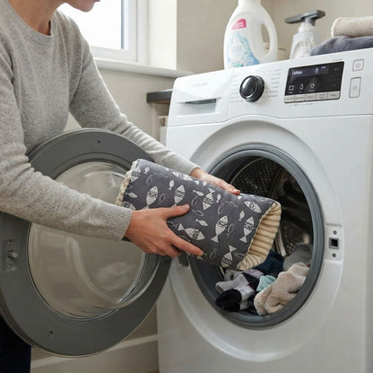 maman place le Coussin d'allaitement dans lave linge